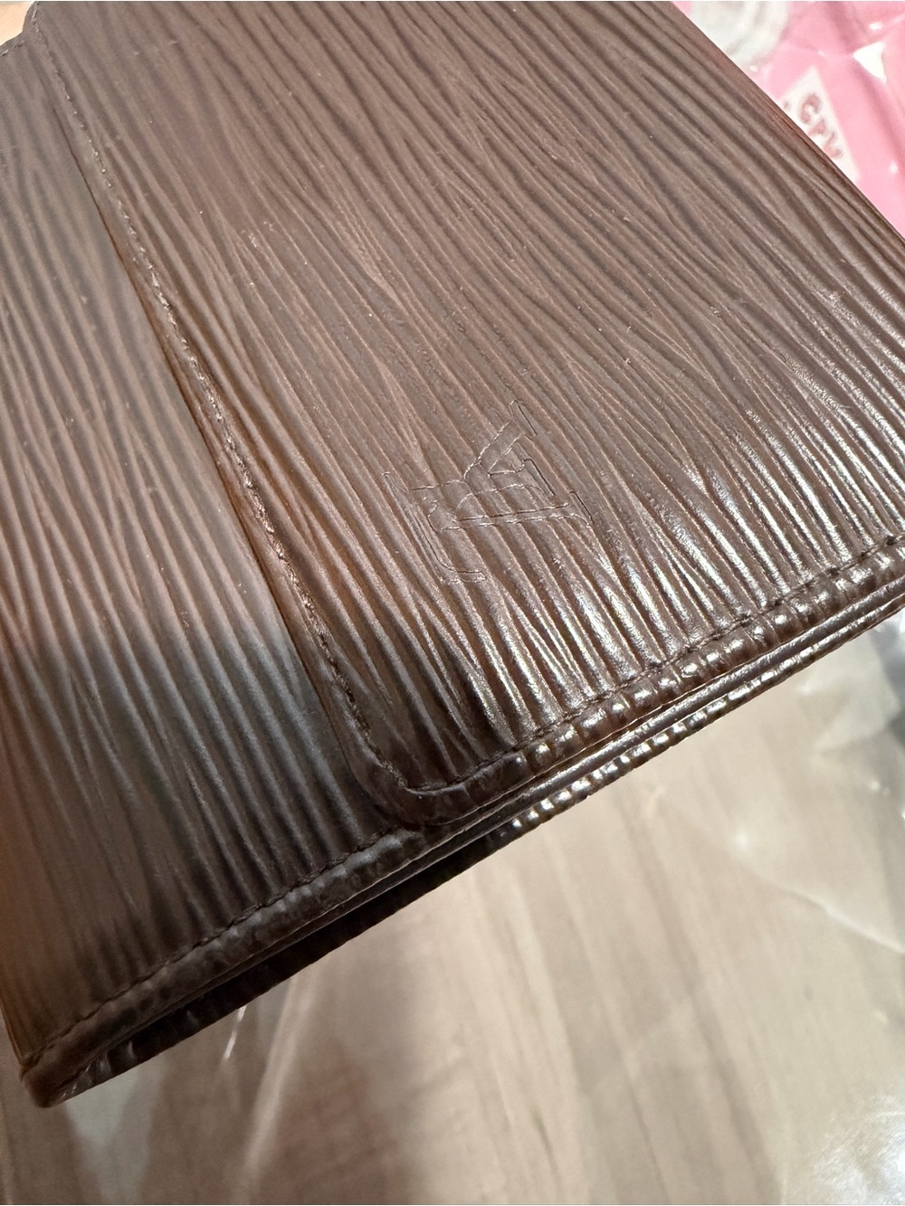 Louis Vuitton Epi Leather Dark Brown Leather bifold wallet.